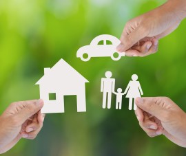 stock-photo-hand-holding-a-paper-home-car-family-on-green-background-insurance-concept-161784542